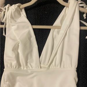 V neck white dress with ruched detailing